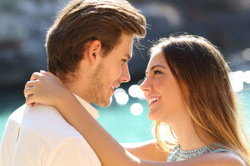 Couple ready to kiss on the beach on vacation