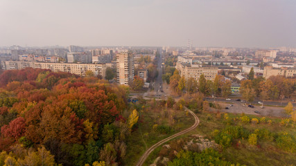 Aerial view of the colorful autumn city. Beautiful view of urban and nature.