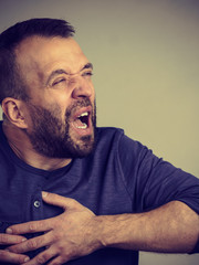 Obraz premium Man having heart pain attack