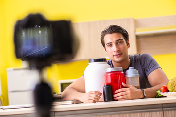 Young man blogging about food supplements