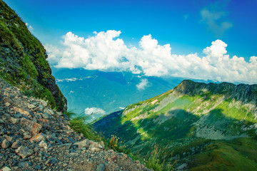 mountains valley in summer afternoon with gentle clouds