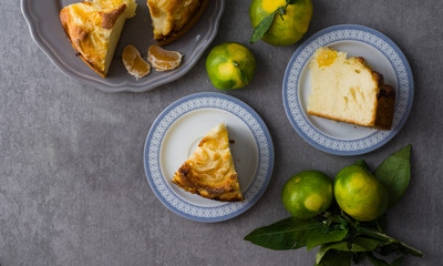 tangerine cake on the grey stone background, top view, flat lay 