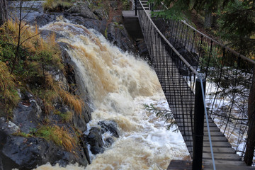 Scenic Karelian waterfall Ahvenkoski in autumn. Russia
