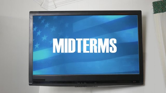 A TV displaying message about the midterm elections