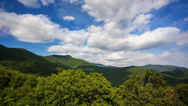 Cinemagraph of clouds over the scenic green smoky mountains of Blue Ridge Parkway in Asheville, North Carolina, timelapse, seamless loop