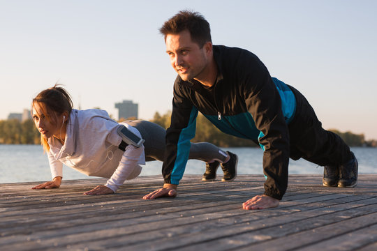 Beautiful Young Couple Working Out Outside