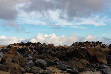 ocky shore and clouds similar in texture in the morning light