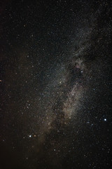 Bright milky way on a summer night through the clouds