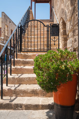 Fototapeta na wymiar Stairs in residential alley and dwellings in old town. Rhodes, Old Town, Island of Rhodes, Greece, Europe.