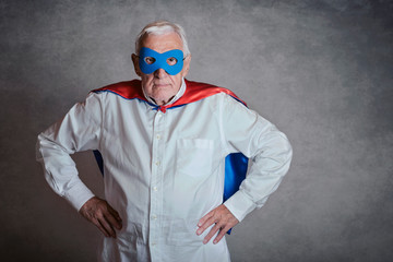 Super grandpa, senior man dressed as a superhero