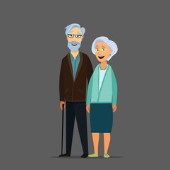 Old senior man and woman in glasses standing or walking together arm in arm. Aged grey haired couple.