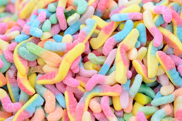 colorful worm shaped candies, sweet background