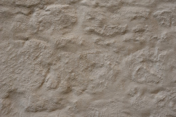 Rough natural stone seamless marble texture surface with cracks, dents, sharp edges. Gray grungy textured backdrop