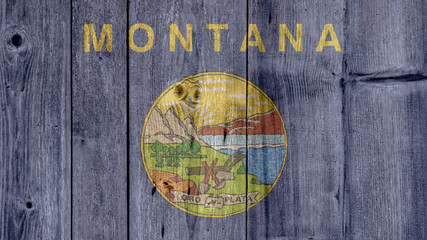 USA Politics News Concept: US State Montana Flag Wooden Fence