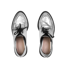 silver elegant shoes isolated on white background, top view