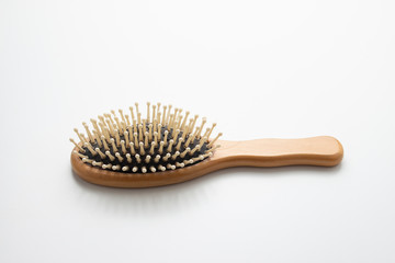 Top view,Old wooden hairbrush on white background