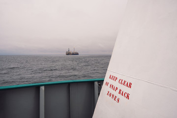 mooring safety onboard ship or vessel. snapback zones danger sign on mooring station. work at sea
