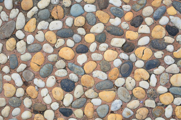 The abstract pattern of wall constructed with pebbles