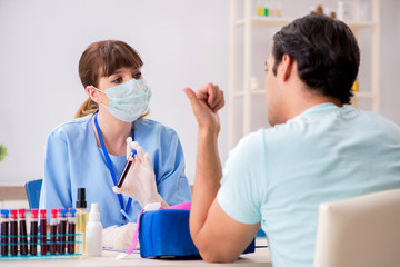 Young patient during blood test sampling procedure  