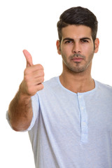 Naklejka premium Young handsome Persian man giving thumb up
