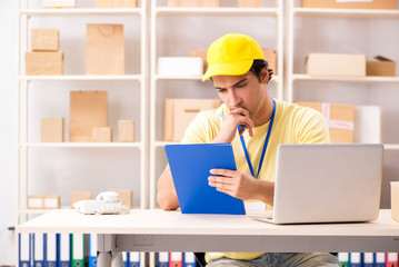 Handsome contractor working in box delivery relocation service 