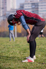 american football player resting after hard training