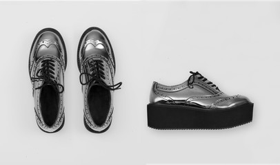 silver metallic  women shoes isolated on white grey background