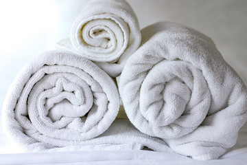 White towel roll  on bed in hotel,Close up