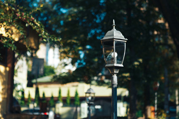 Fototapeta na wymiar Old street lamp in the street in the afternoon
