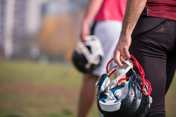 American football player holding helmet