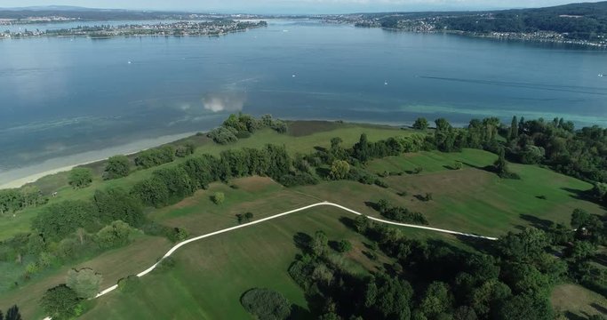 Drone aerial at Lake Constance with view at the island Reichenau 4K pan to the right and than flight backwards