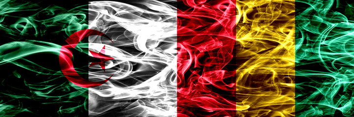 Algeria, Algerian vs Guinea, Guinean smoke flags placed side by side. Concept and idea flags mix.