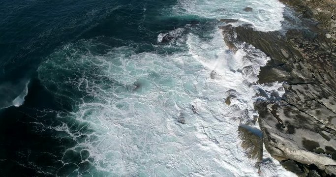 Open sea surface with waves under sun light near australian coast of Sydney – endless sky less vista and fluid pattern seen from above top down.
