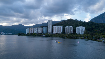 Fototapeta premium aerial view of the drone of the lagoon in rio de janeiro and copacabana, at dusk