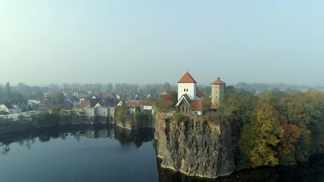 Church Overlooking a Small and Beautiful Lake on a Foggy Morning