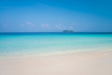 Fototapeta na wymiar Beautiful tropical island white sand beach blue sky sunny day - Summer breeze holiday