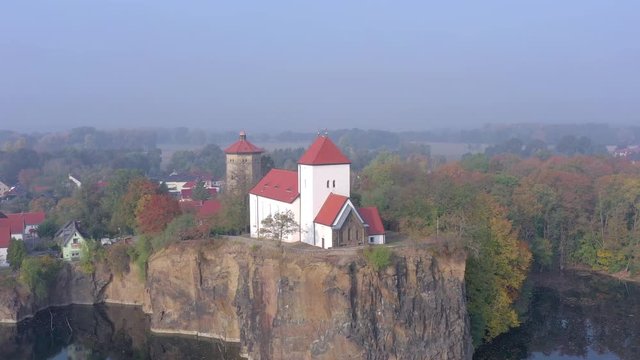 Church Overlooking a Small and Beautiful Lake on a Foggy Morning