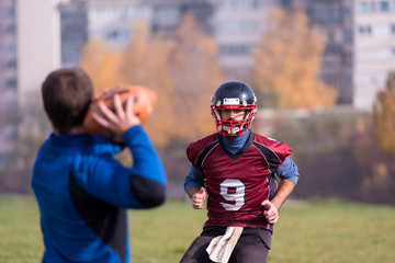 american football team with coach in action