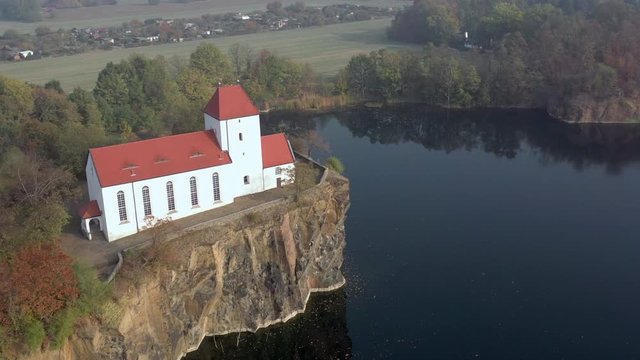 Church Overlooking a Small and Beautiful Lake on a Foggy Morning