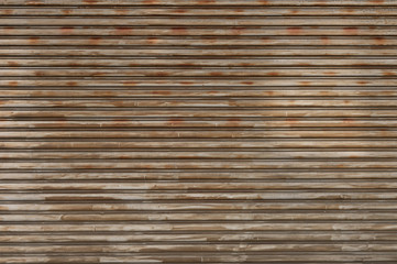 A closeup shot of automatic metal roller door used in factory, storage, garage, and industrial...