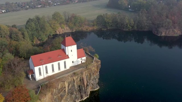 Church Overlooking a Small and Beautiful Lake on a Foggy Morning