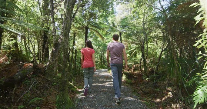 New Zealand. People hiking in swamp forest nature landscape in Ship Creek on West Coast of New Zealand. Tourist couple sightseeing tramping on South Island of New Zealand.