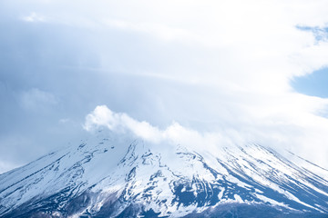 Close up top of beautiful Fuji mountain (fujisan) with snow cover on the top with could, Japan