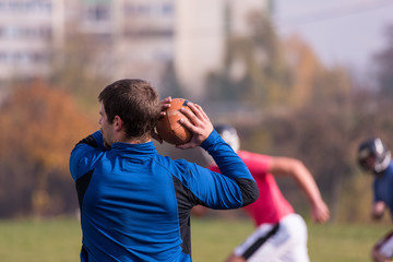 Fototapeta premium american football team with coach in action