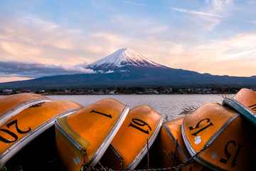 Beautiful scenery during sunset of Lake kawaguchiko in Japan with the rowboat parked on the...