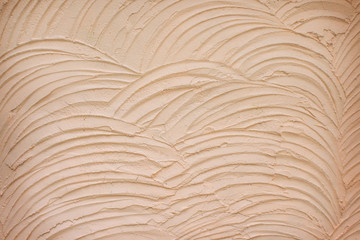 Plastering the concrete wall in seamless wave patterns on background