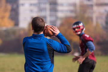 american football team with coach in action