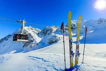 Fotobehang Ski in winter season, mountains and ski touring backcountry equipments on the top of snowy mountains in sunny day, Verbier Switzerland. © Gorilla