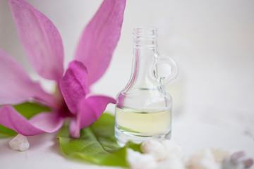 Fototapeta na wymiar Floral oil bottle, spa still life closeup