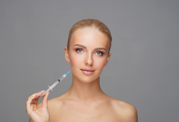 Beauty injection in a face of a young woman. Plastic surgery concept.